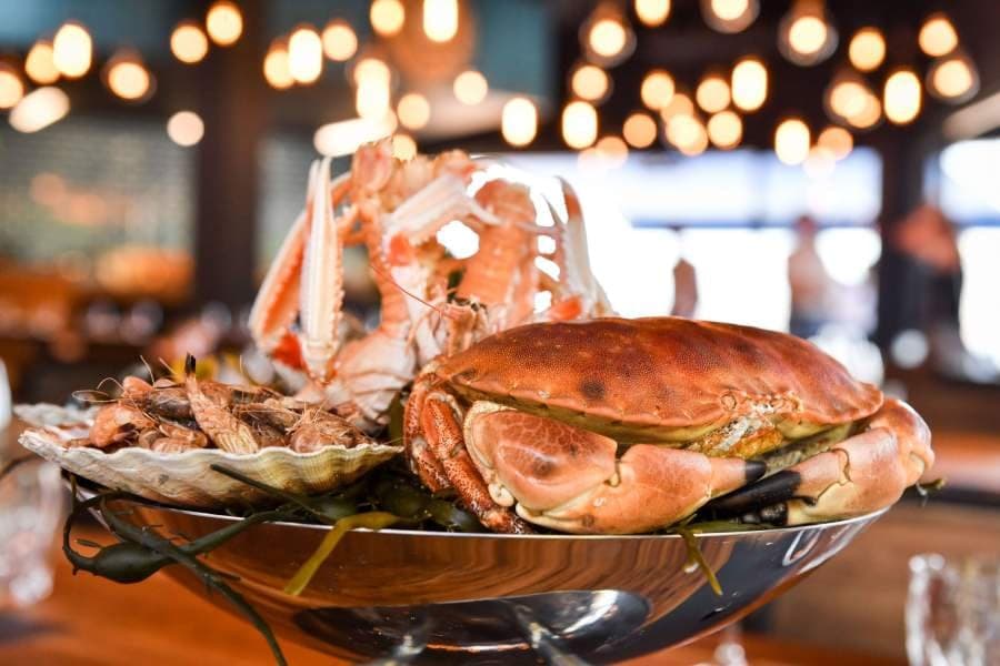 A seafood platter at Coutanceau, oysters, langoustines and crab on crushed ice.