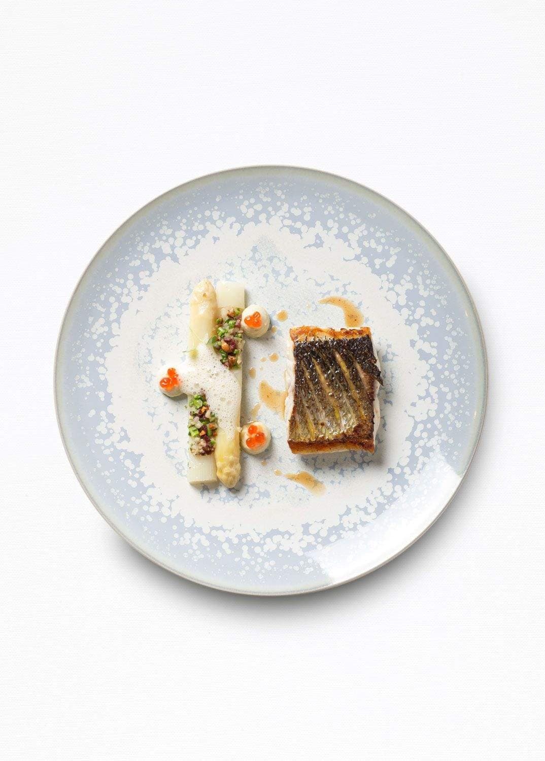 Line bass with white asparagus and Jabugo, a signature plate at Coutanceau.