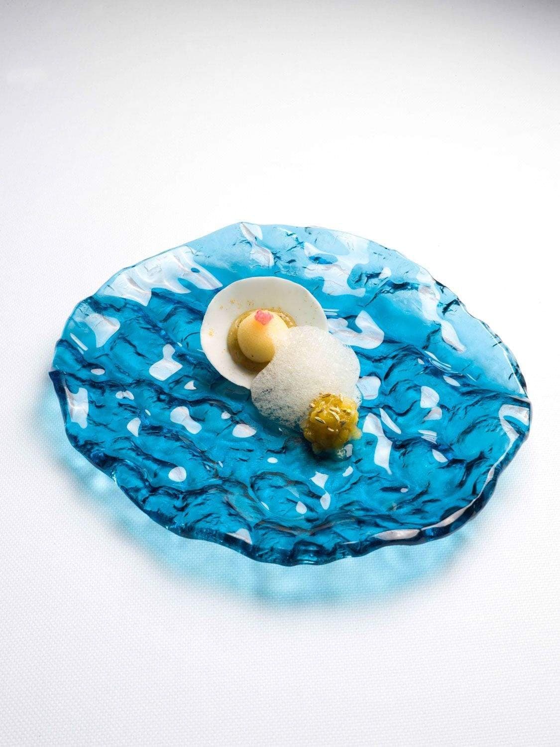 Shellfish under an iced glaze of Île de Ré plants and herbs, a plate from the Atlantic.