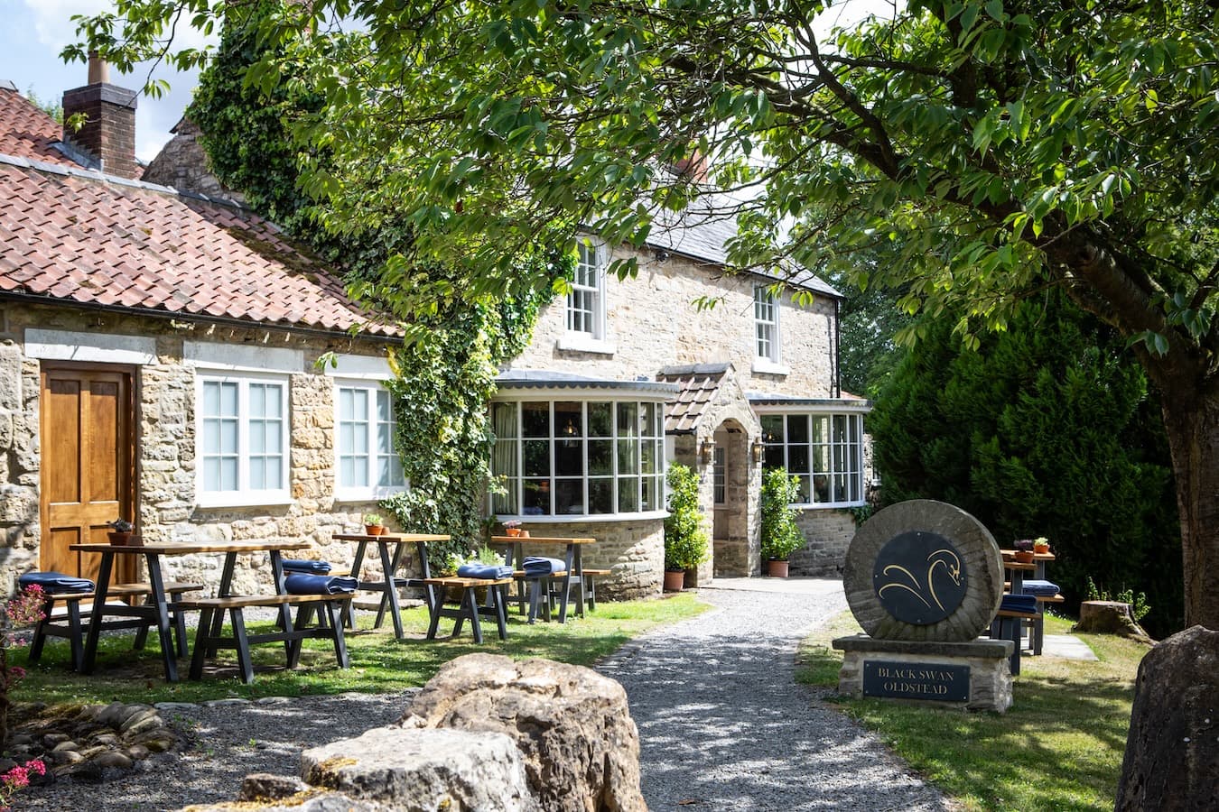 The Black Swan at Oldstead — pale-stone pub at the edge of the North York Moors.